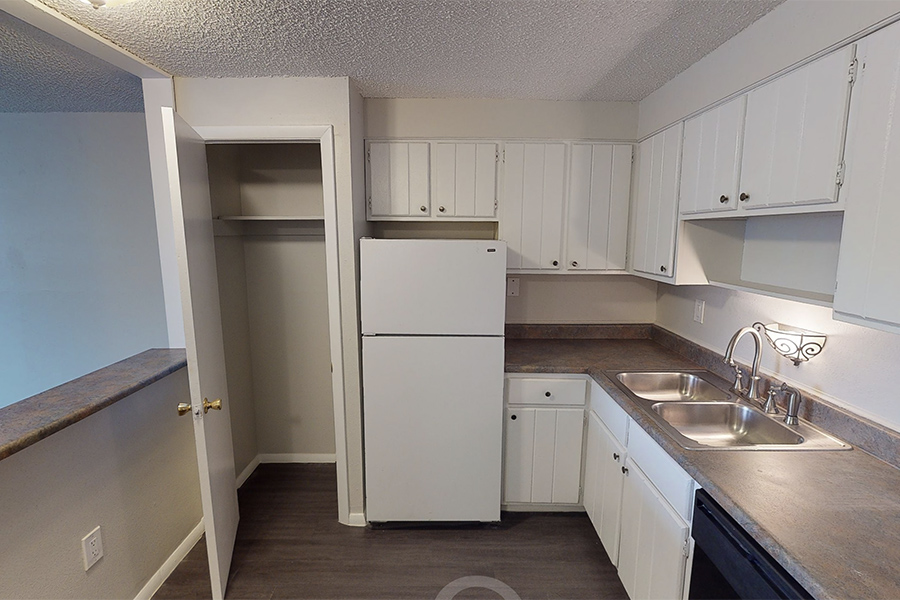3D tour thumbnail showing kitchen with large cupboard, wood floors, and white appliances.