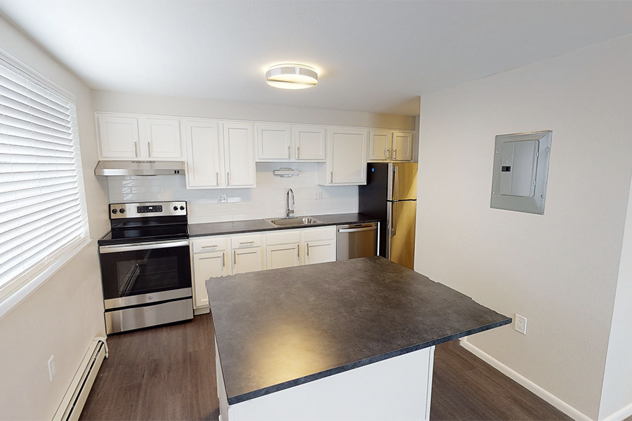 3D tour thumbnail showing kitchen with large island, white cabinets, and stainless appliances.